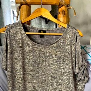 This is a beautiful blouse. Whom ever adds this to their closet will to